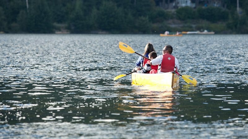 Family canoeing in Whistler lake