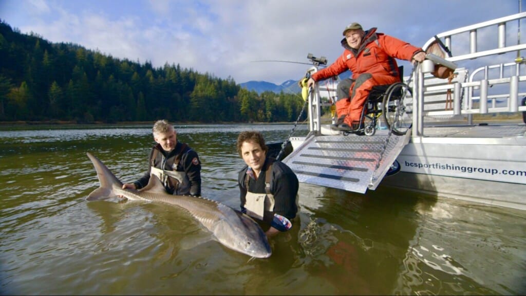 Rick Hansen sturgeon fishing with Jonny Harris for a segment featuring Harrison Hot Springs on CBC's Still Standing