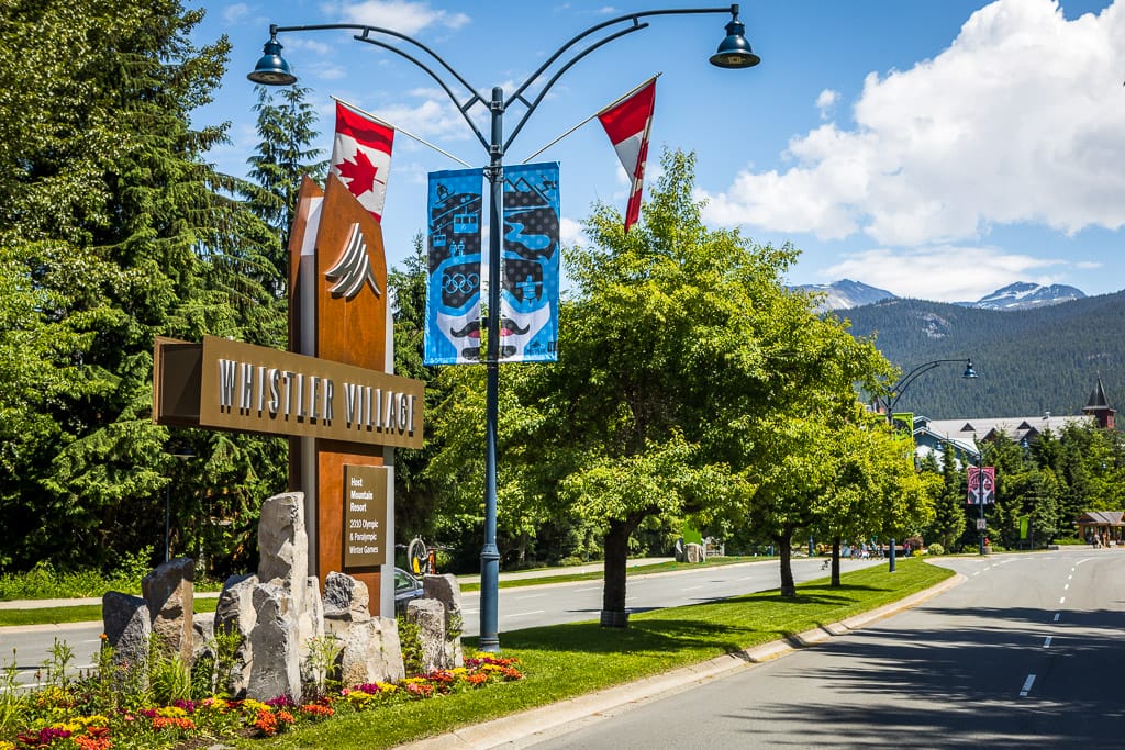 The entrance sign to Whistler Village on a summer day