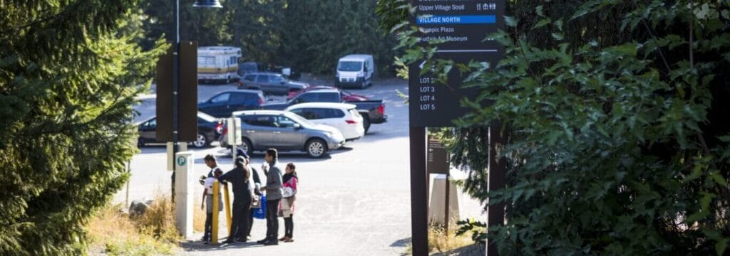Visitors pay for parking in Whistler's Lot 1