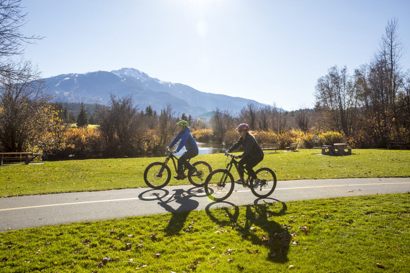 Couple biking on the Valley Trail in Whistler.
