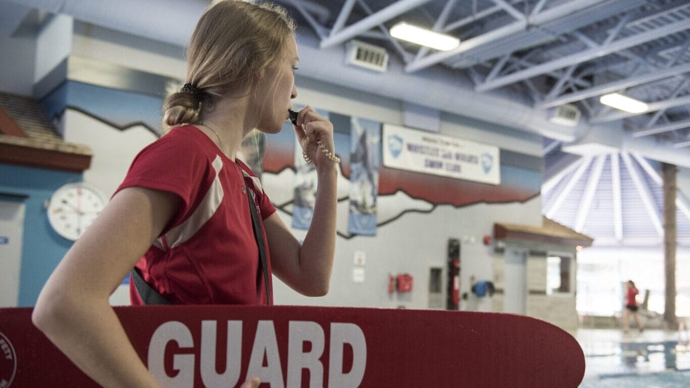Lifeguard preparing to blow whistle