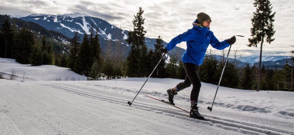 woman nordic skiing with Whistler-Blackcomb mountain in the background