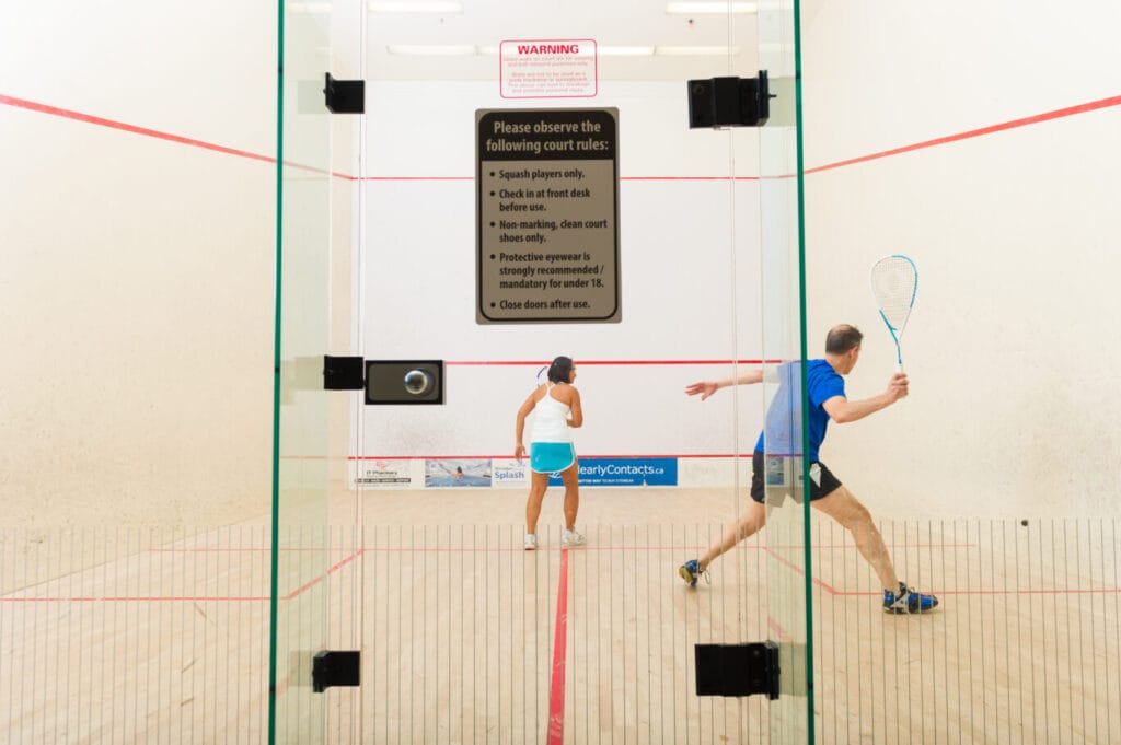 two squash players playing a match