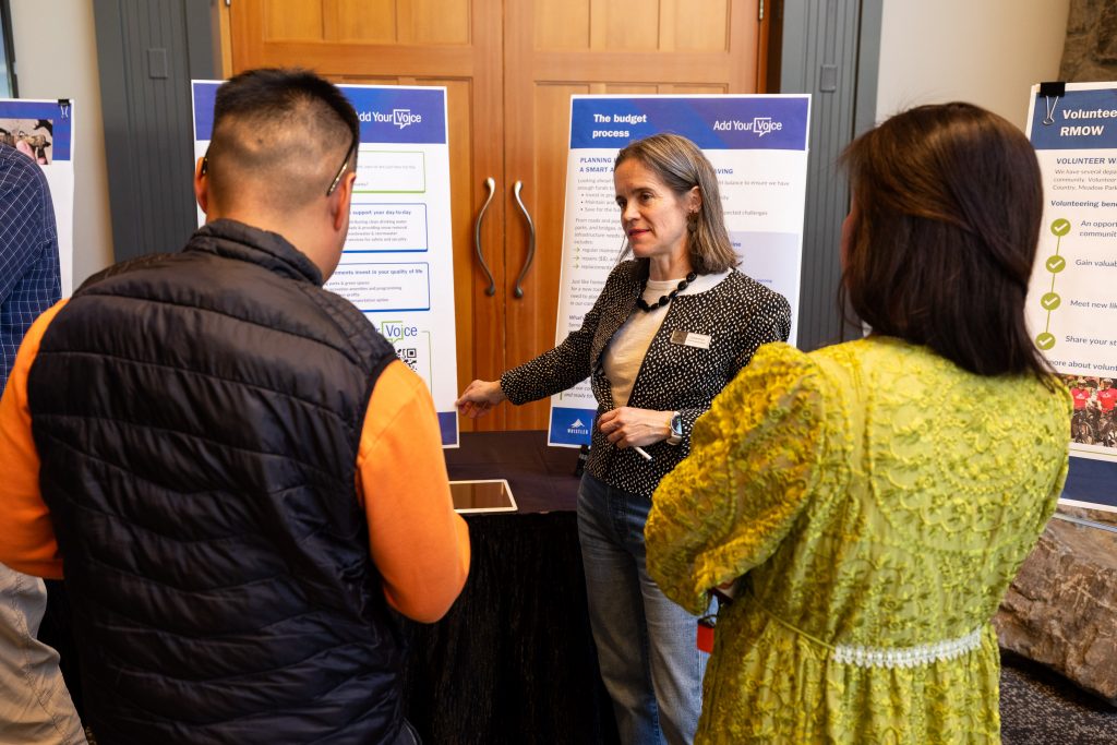 Community members talking to the Director of Finance