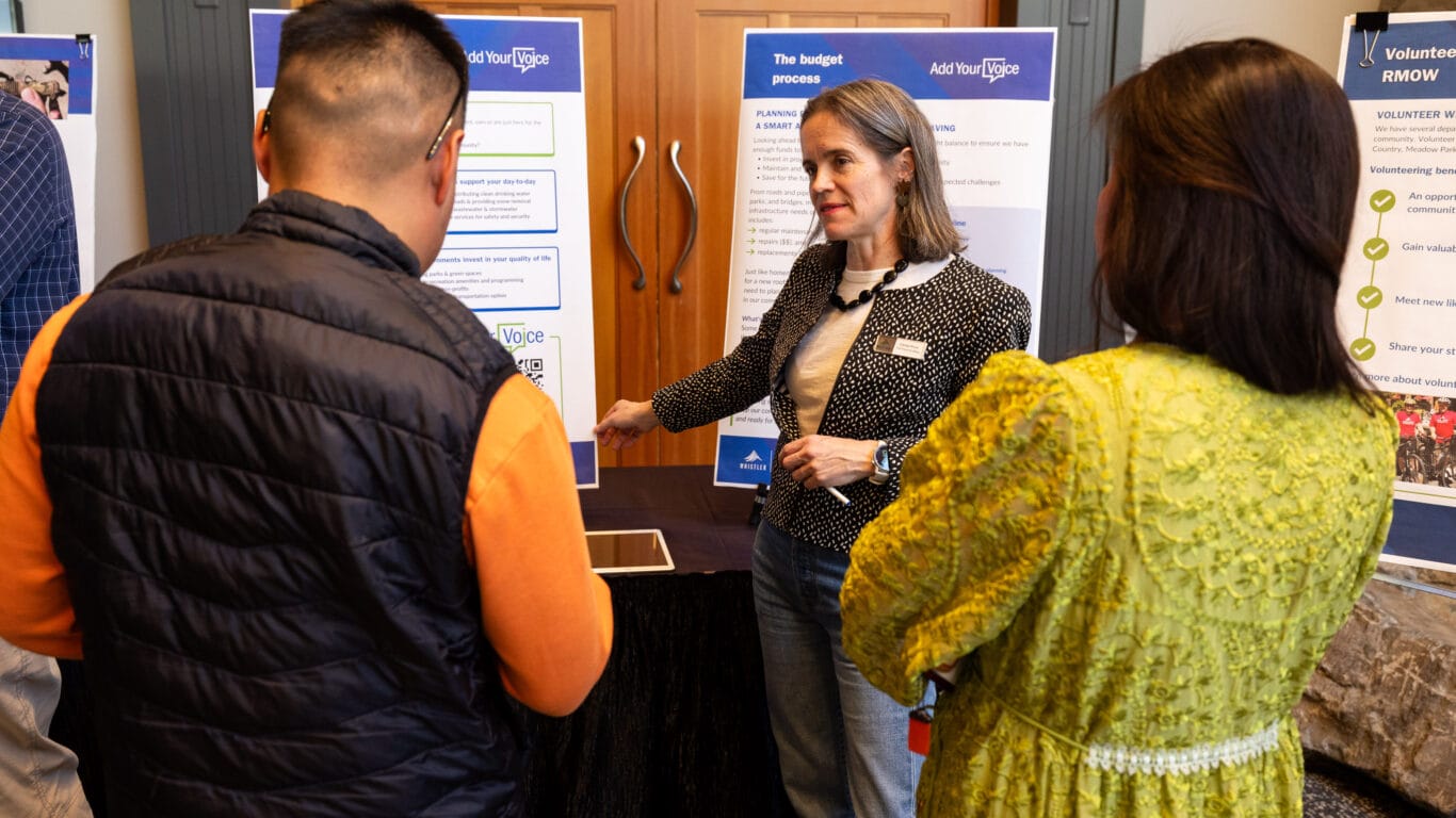 Community members talking to the Director of Finance