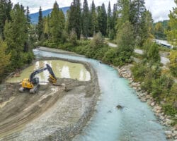 Excavator removing gravel from the Fitzsimmons Creek in Whistler